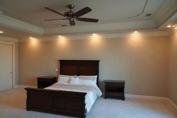 A Queen Size Bed With Two Wooden Bedspace