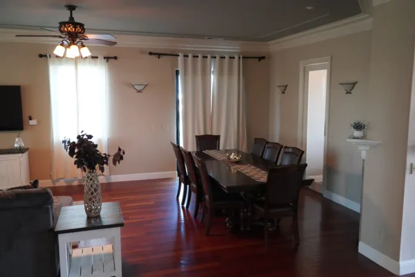 A Dining Room With Panel Wood Flooring