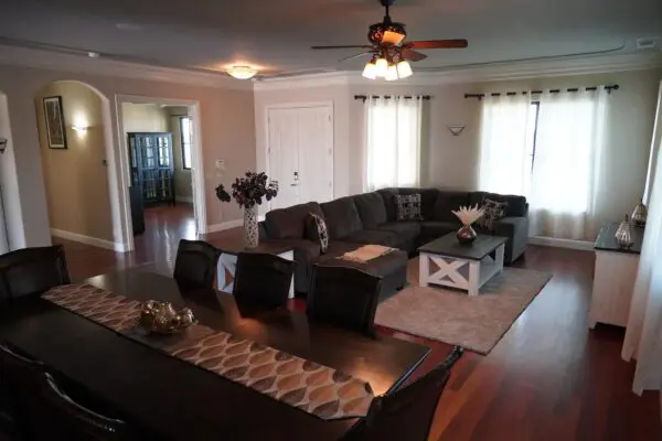 A Living Room Area With a U Shape Couch Area