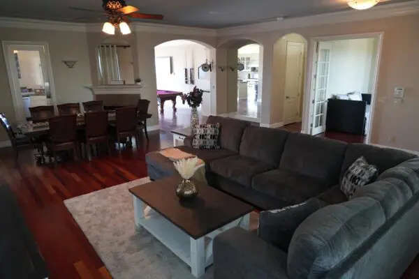 A Grey Color Couch With a Wood Table